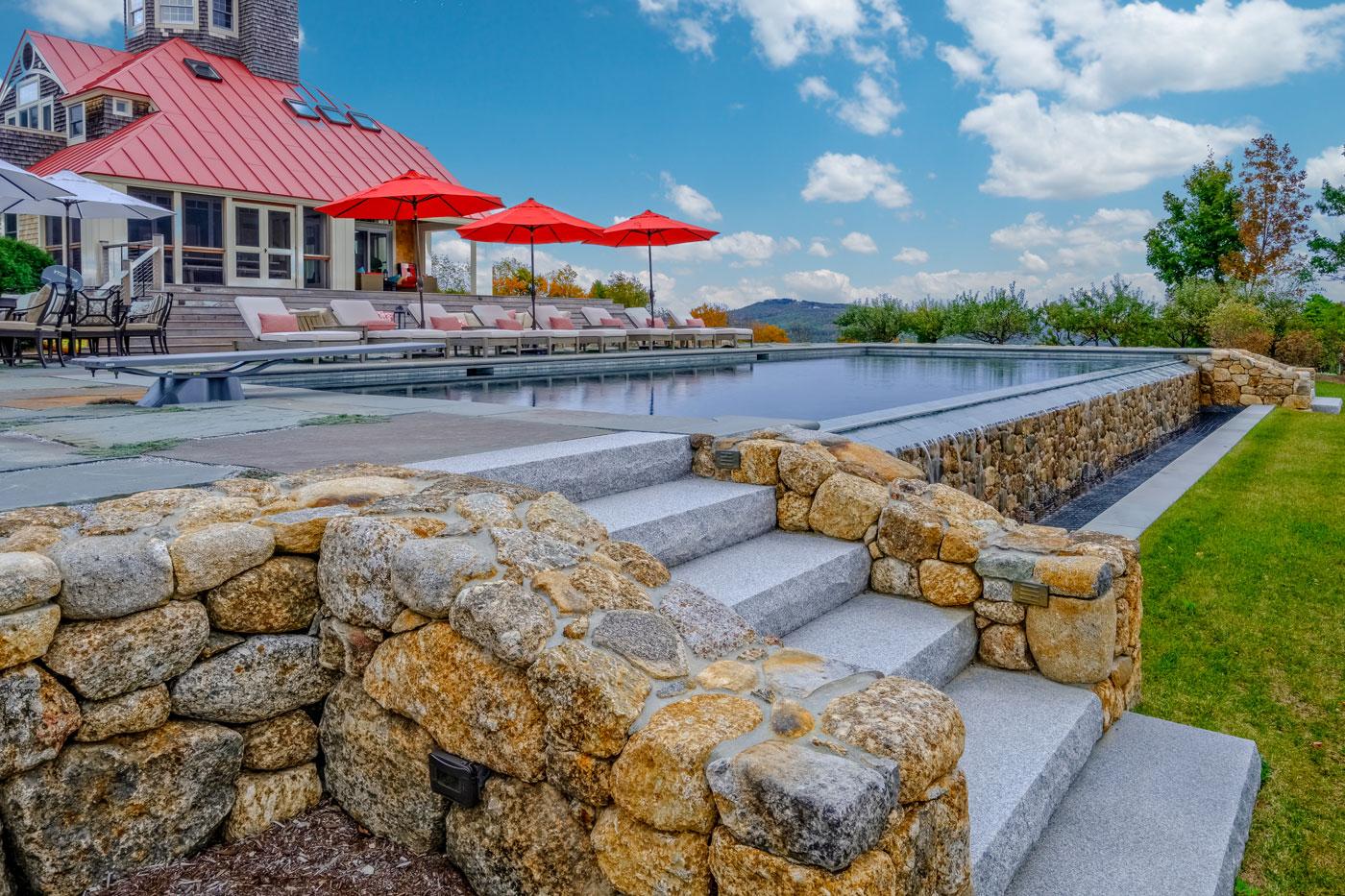 Pool terrace with a view by high-end landscape design/build firm Pellettieri Associates, Inc.